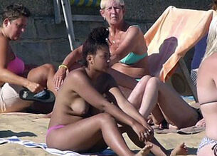 Girls in thongs on beach